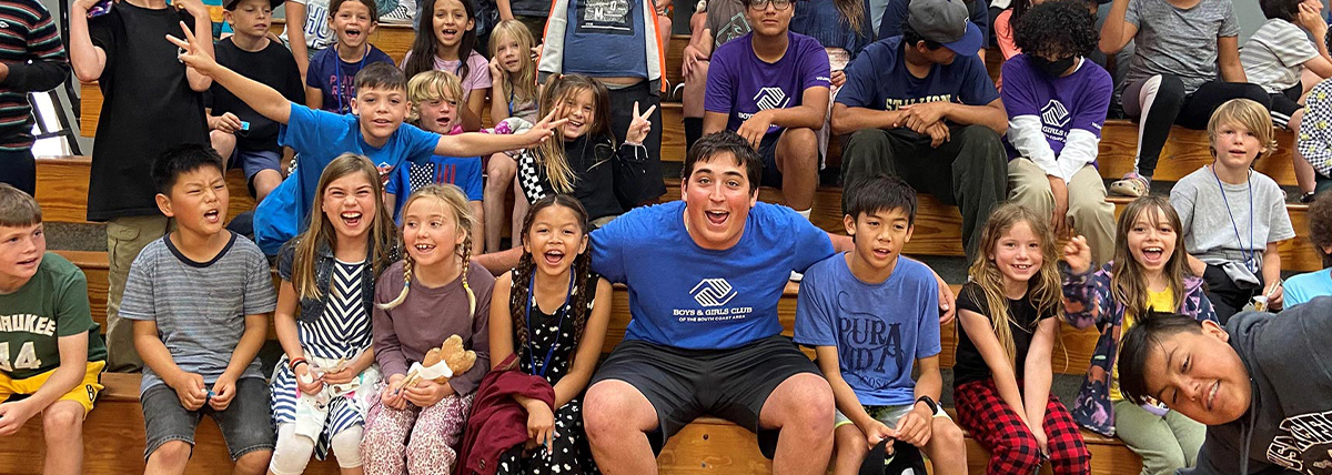 Summer-camp-program Camp Councilor posing with all the kids from summer camp 2022