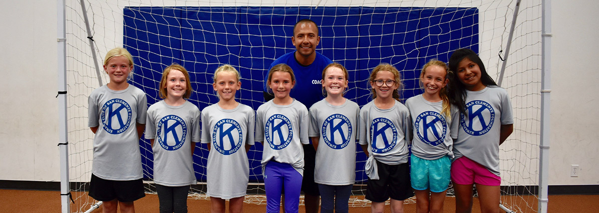 team-sponsor Volunteer Coach with his indoor soccer team